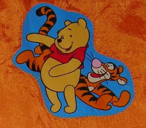 front side a hug side b pooh tigger on orange