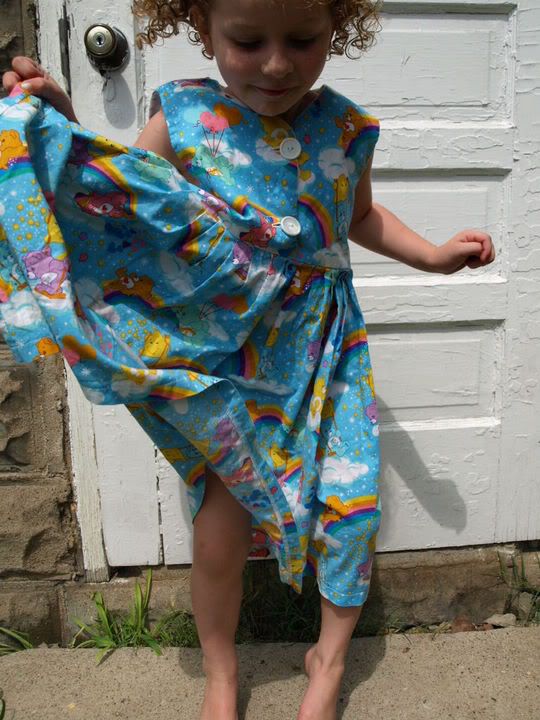 terrific little care bears dress is handmade buttons up the front has 