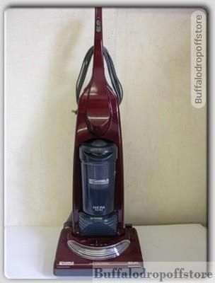 Red Kenmore Progressive bagless Vacuum Cleaner.